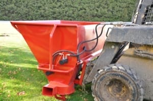 Sawdust-blower-side-view A skid steer loader with a new sawdust blower attached.